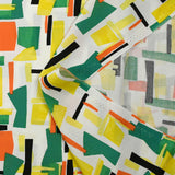 Viscose imprimée graphique orange, jaune et vert fond blanc