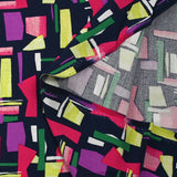 Viscose imprimée graphique fuchsia, mauve et vert fond marine