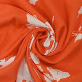Viscose imprimée silhouette florale fond orange