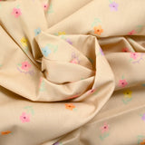 Printed cotton small colorful flowers beige background