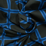 Satin de coton élasthanne carreaux bleu fond noir
