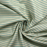 Cotton printed with turquoise churrant stripes light beige background