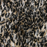 Dentelle imprimée instinct animal léopard fond beige