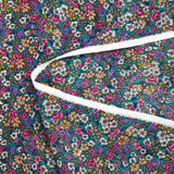 Mousseline de polyester lancée découpée fleurs fond turquoise