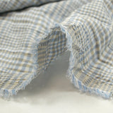 Crinkled checkered cotton sky and taupe white background