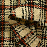 Tweed de laine tartan orange brûlé fond sable