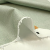Popeline de coton imprimée vol d'oiseau fond vert-de-gris