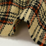 Tweed de laine tartan orange brûlé fond sable