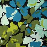 Crépon de viscose imprimé éclat de fleurs pétrole et anis fond noir