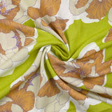 Crépon de viscose imprimé pivoine élégante fond vert anis