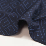 Jersey de coton imprimé monogramme fond bleu marine