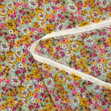 Mousseline crinkle imprimée lurex prairie fleurie rose fond vert d'eau