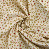 Cotton poplin printed with abstract flowers on an ecru background