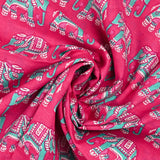 Algodón indio estampado con elefante turquesa y fondo rosa.