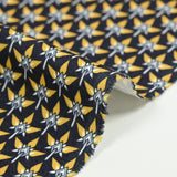 Velours polyviscose imprimé graphique jaune fond bleu marine