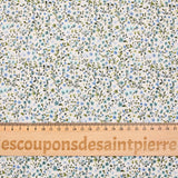 Voile de coton imprimé digital fleurettes bleues et feuillage vert sur fond écru
