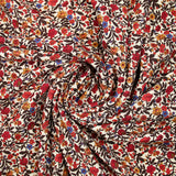 Viscose imprimée fleur rouge jaune et bleu fond beige