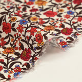 Viscose imprimée fleur rouge jaune et bleu fond beige