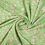 Viscosa estampada primavera blanco roto con fondo verde claro