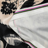 Short velvet jersey with black graphic leaf print and ivory background
