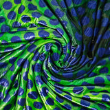 Velours de polyester Lurex imprimé grand pois bleu fond vert