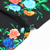 Satin viscose knit bouquet of flowers black background