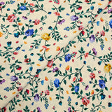 Viscose knit printed with small country flowers on beige background