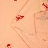 Double gauze printed with red lobster and apricot background