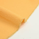 Sergé de laine mélangée bouclette jaune beurre