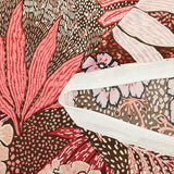 Jersey de polyester floqué et imprimé feuillage rose fond marron