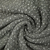 Polyester terry wool and white confetti, gray background