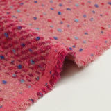Wool blend tweed with raspberry check and pink confetti background