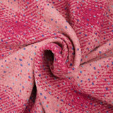 Wool blend tweed with raspberry check and pink confetti background