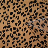 Crêpe satiné de polyester sauvage noire fond mordoré