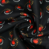Gabardine de laine mélangée imprimée éclipse orange fond noir