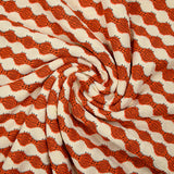 Maille polyester fantaisie écru et orange