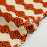 Maille polyester fantaisie écru et orange
