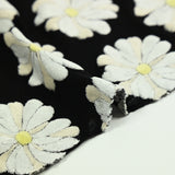 Cotton jersey printed marguerite sponge in relief black background