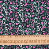 Cotton voile digitally printed meadow of small pink and water green flowers on a black background