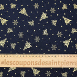 Popeline de coton imprimée sapins, boules et flocons dorés fond bleu nuit