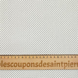 Viscosa estampada con lunares blancos.