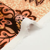 Viscose imprimée fleurs de porcelaine marron et corail fond abricot