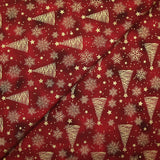 Cotton poplin printed with golden fir trees on a red marbled background