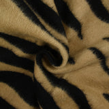 Wool woolen wool and black tiger silk brown background