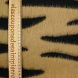 Wool woolen wool and black tiger silk brown background