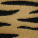 Wool woolen wool and black tiger silk brown background