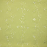Voile de polyester brodé fleurs et feuillages vert anis