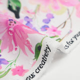 Voile 100% coton Plumetis imprimé printemps rose