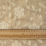 Voile de polyester froissé et brodé fleurs fond beige