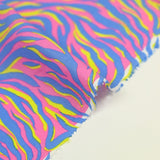 Coton imprimé zèbre jaune et bleu fond rose